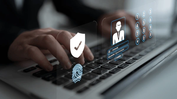 hands of a person typing on keyboard