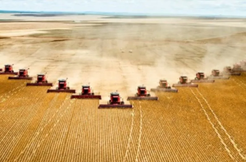 farm tractors harvesting crops