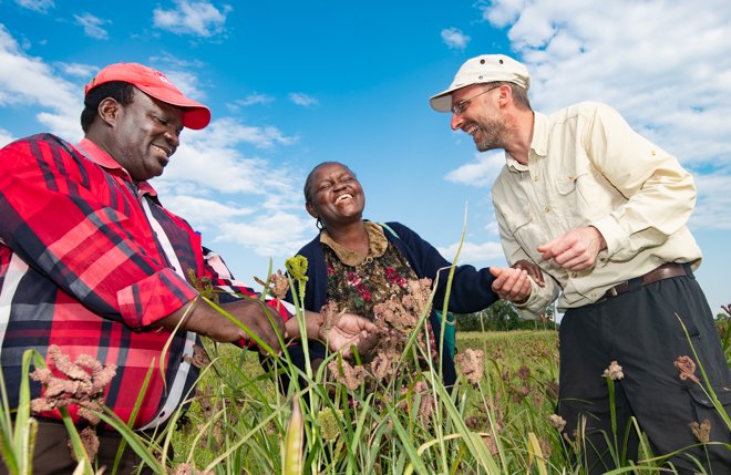 farmers smiling at each other